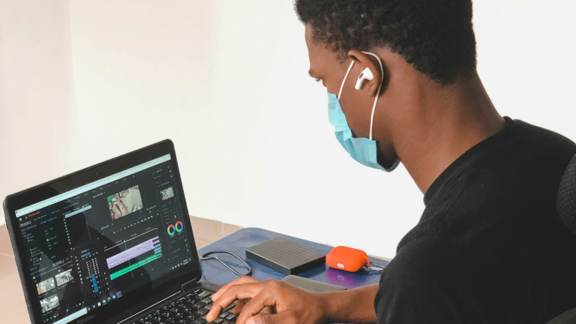 man in black crew neck t-shirt using black laptop computer