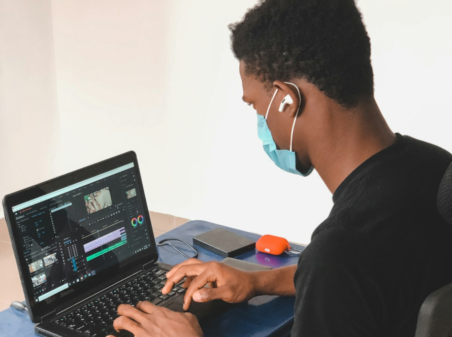 man in black crew neck t-shirt using black laptop computer